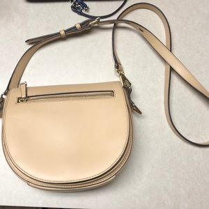 Nude cross body